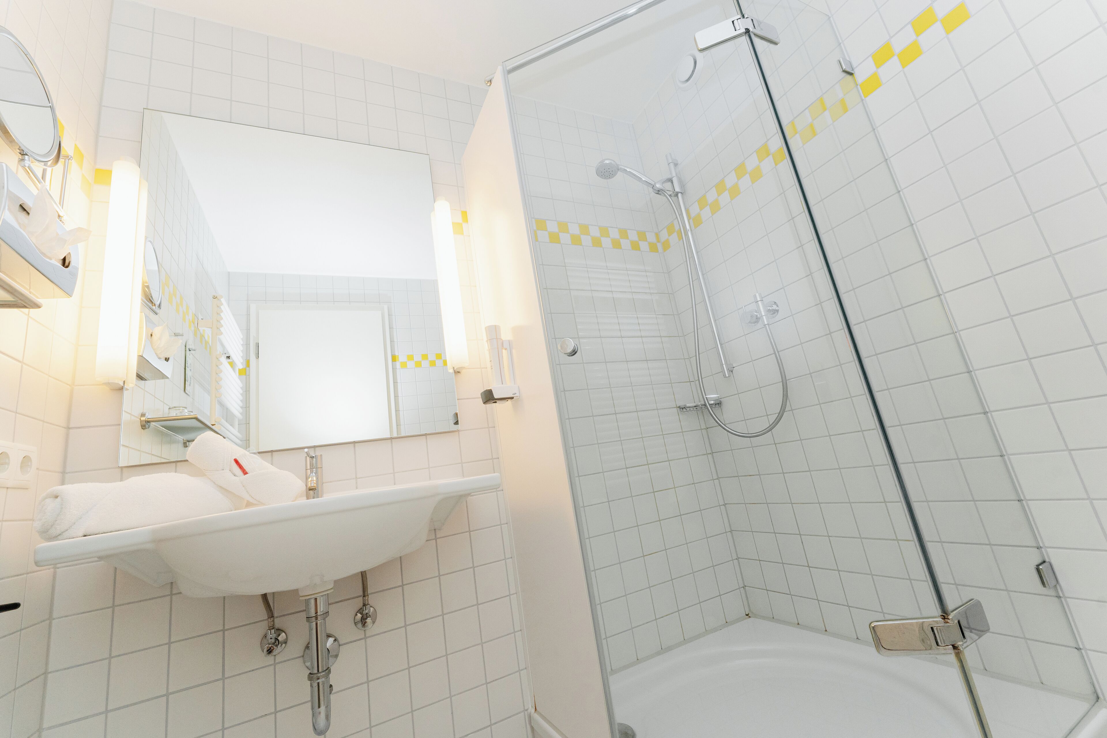 Shower, eco-friendly toiletries, hair dryer, towels