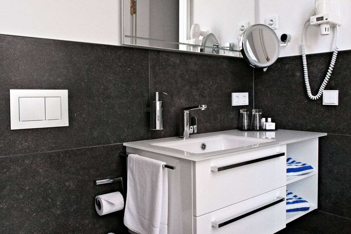 single room | bathroom | shower, hair dryer, bathrobes, slippers