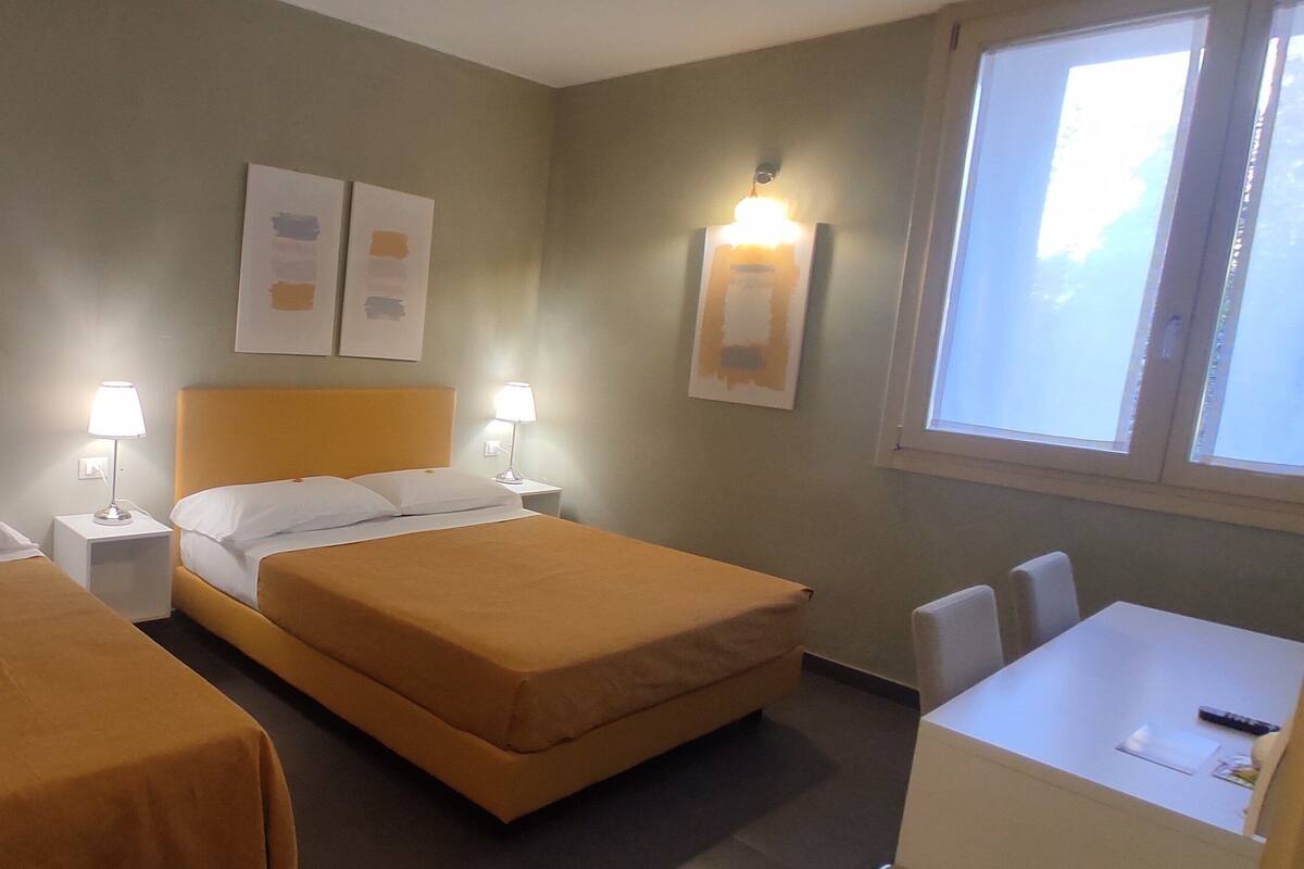 Family Triple Room | Minibar, individually decorated, individually furnished, desk