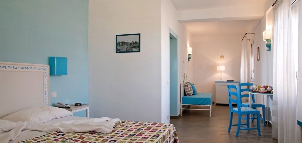 family room | 1 bedroom, premium bedding, minibar, in-room safe