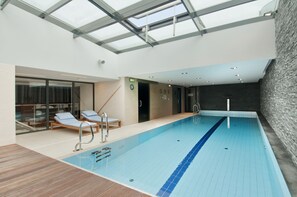 Indoor pool, open 9:30 AM to 9:00 PM, pool loungers