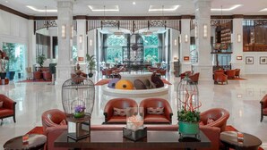 A spacious lobby with a grand chandelier, multiple seating areas, and a central decorative feature. - Sofitel Phnom Penh Phokeethra (Phnom Penh)
