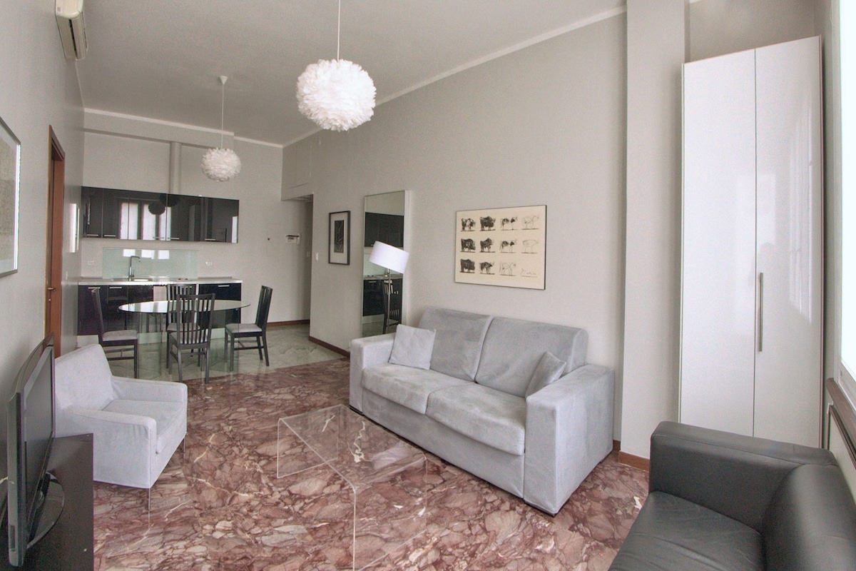 Large 1-Bedroom Apartment with Balcony, Via Pergolesi 31 | Living area | 32-inch flat-screen TV with satellite channels, LCD TV, DVD player