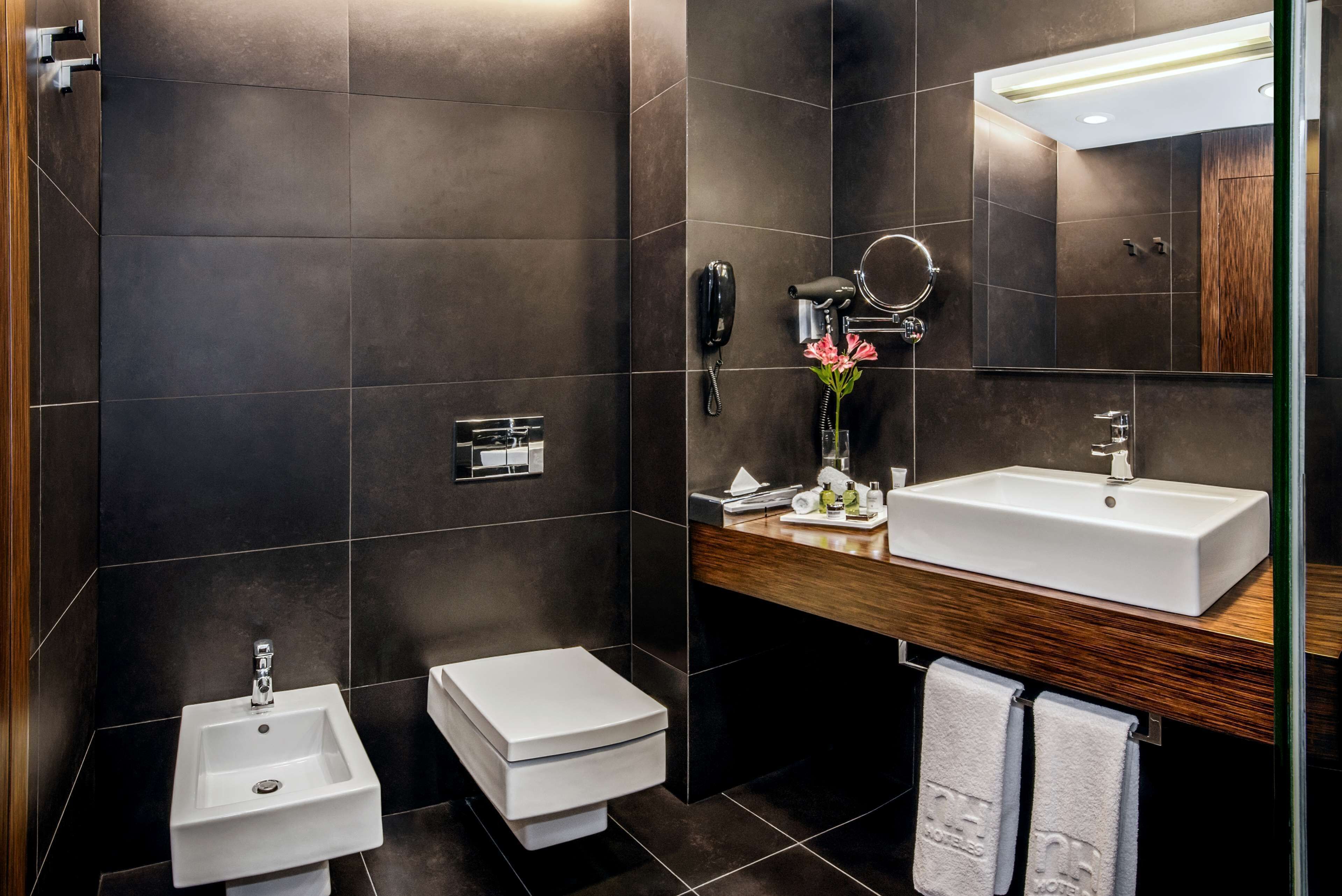 deep-soaking bathtub, rainfall showerhead, eco-friendly toiletries