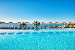 Indoor pool, outdoor pool, pool umbrellas, pool loungers