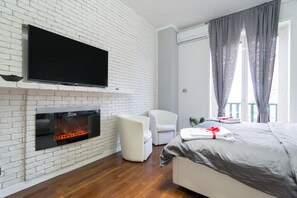 Apartamento, en edificio anexo | Zona de estar | Televisión LCD de 40 pulgadas con canales por cable, una televisión