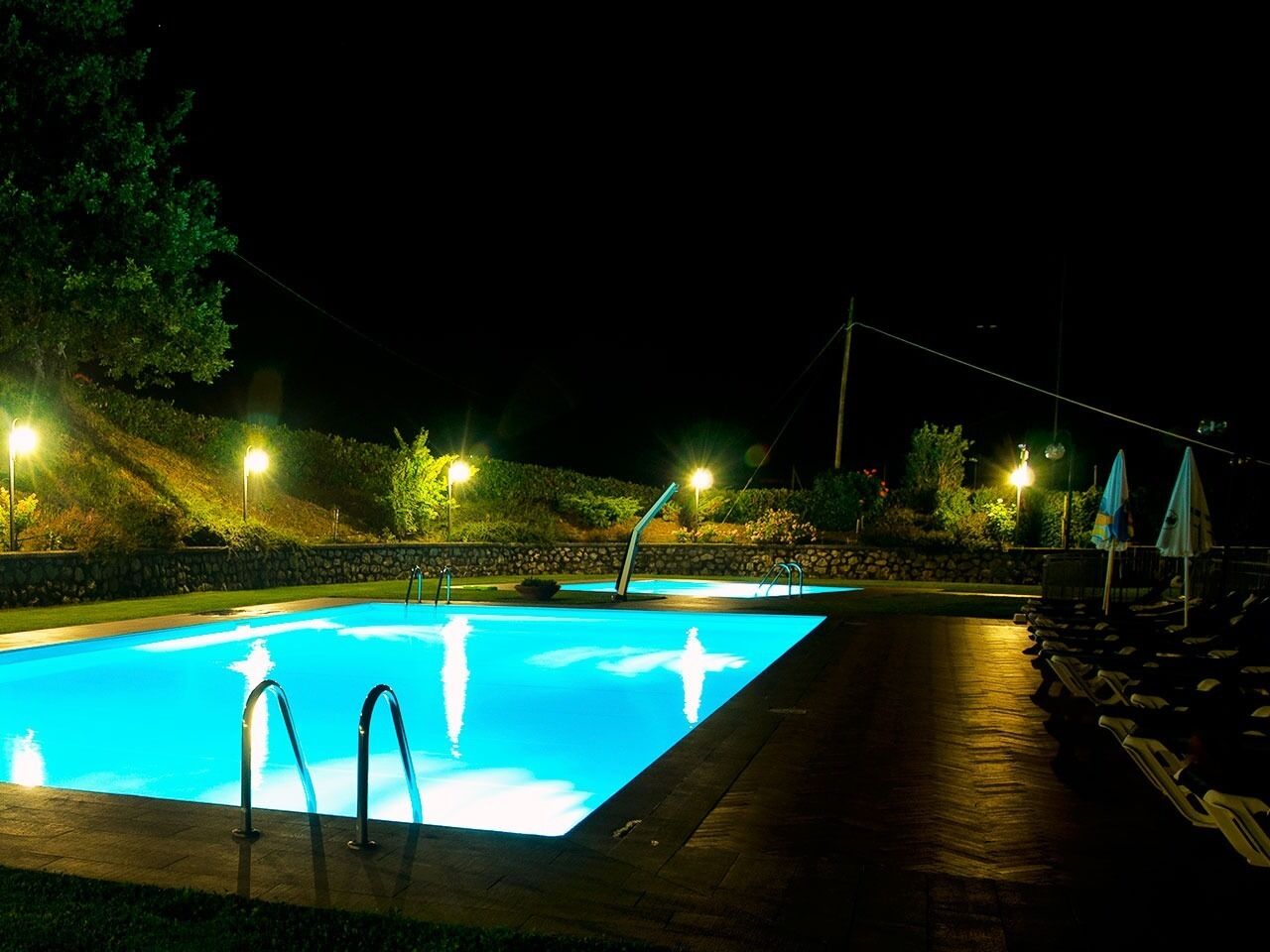 2 outdoor pools, open 8:00 am to 7:00 pm, pool umbrellas, pool loungers