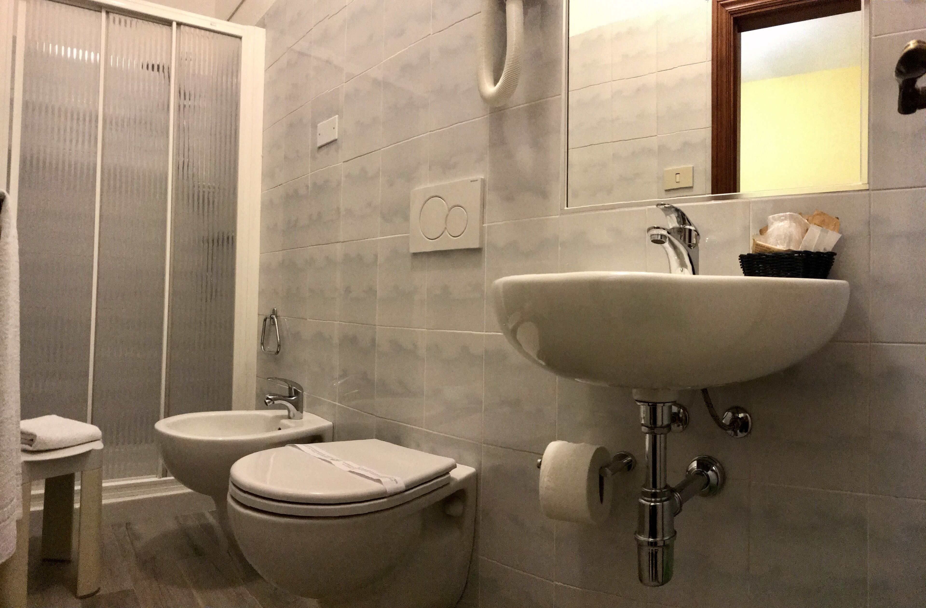 standard single room | bathroom | shower, free toiletries, hair dryer, towels