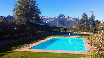 2 outdoor pools, open 8:00 AM to 7:00 PM, pool umbrellas, pool loungers