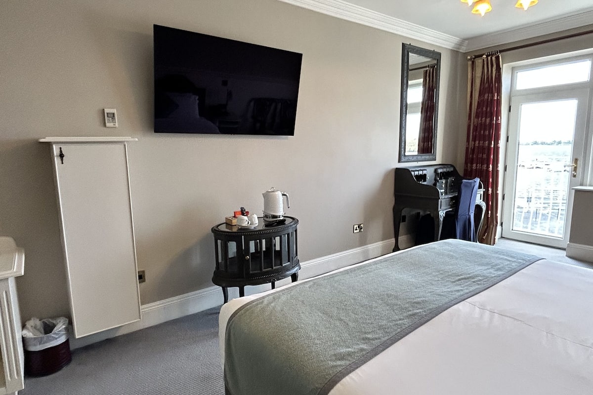 superior double room, lake view | in-room safe, desk, laptop workspace, iron/ironing board