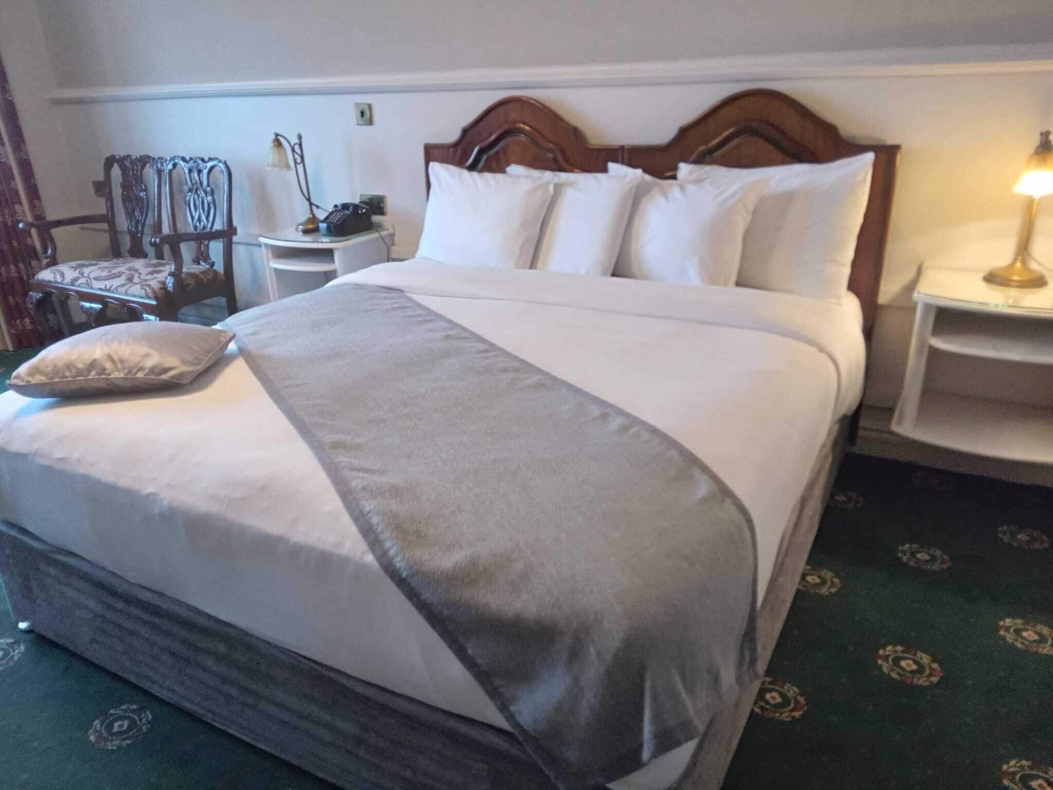 superior double room, lake view | in-room safe, desk, laptop workspace, iron/ironing board