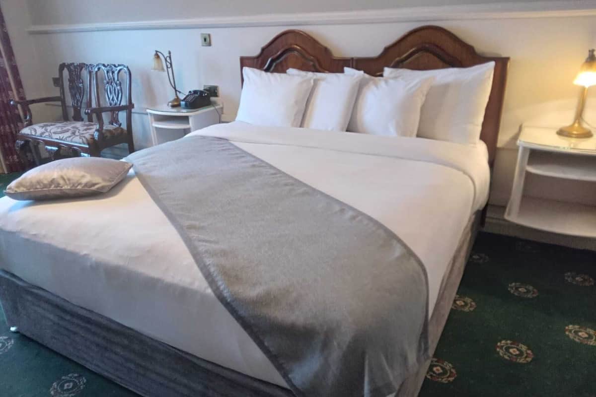 superior double room, lake view | in-room safe, desk, laptop workspace, iron/ironing board