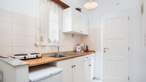 Comfort Apartment, 2 Bedrooms, Kitchenette, Courtyard View | Private kitchen | Coffee/tea maker, fridge, cookware/dishes/utensils - Betty Apartments (Paros)