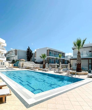 Indoor pool, 2 outdoor pools, open 10:00 AM to 7:00 PM, pool umbrellas