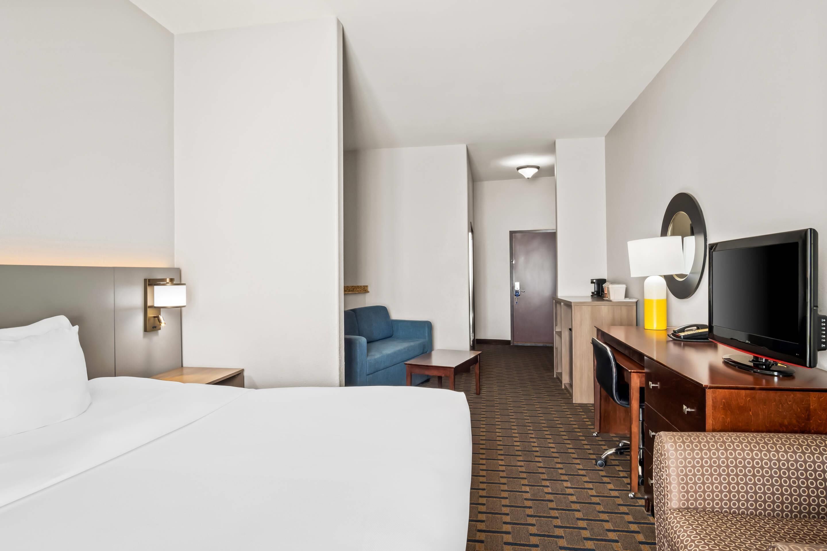 suite, 1 king bed, non smoking | premium bedding, desk, laptop workspace, blackout curtains