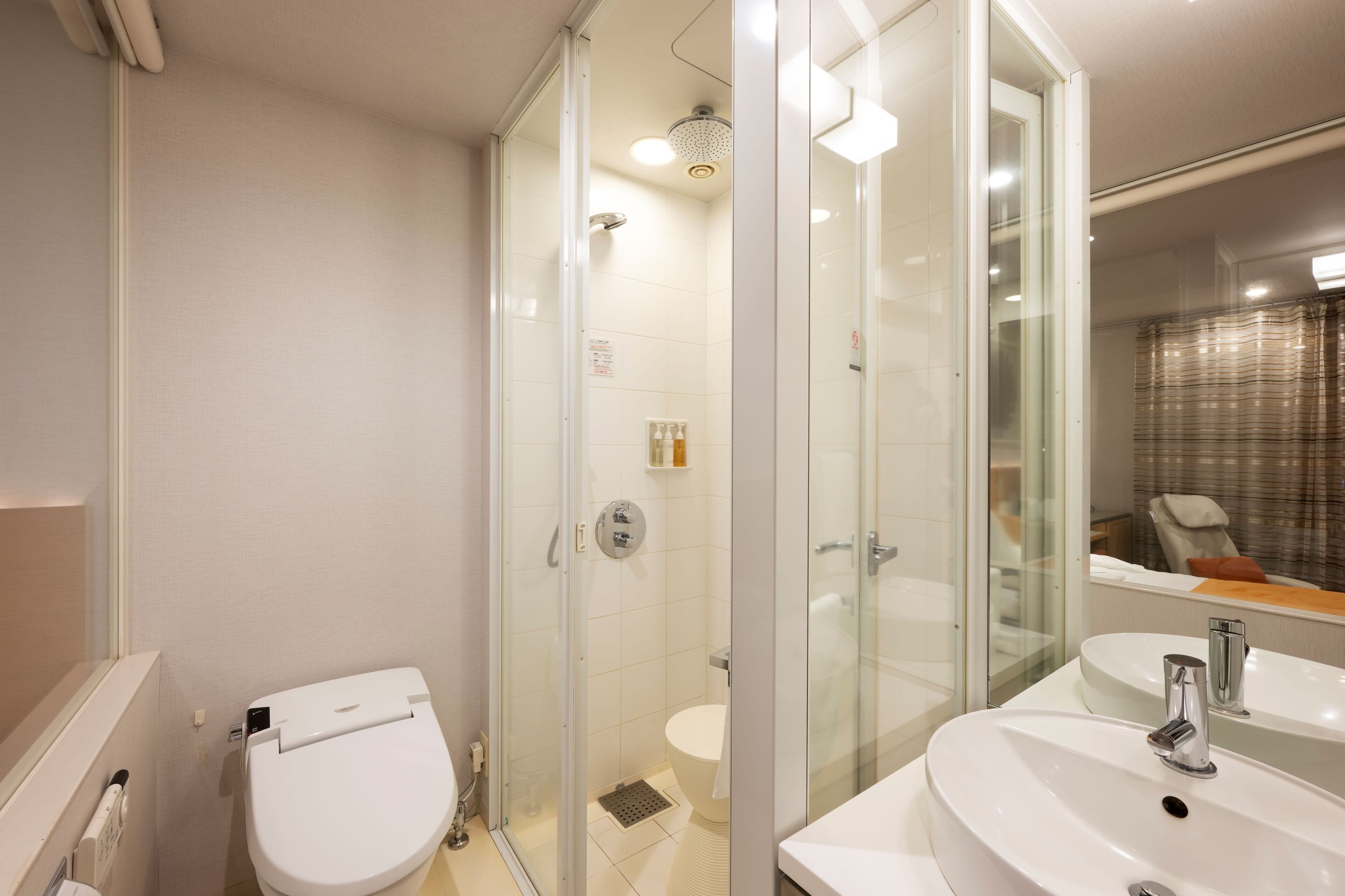 eco-friendly toiletries, hair dryer, slippers, electronic bidet