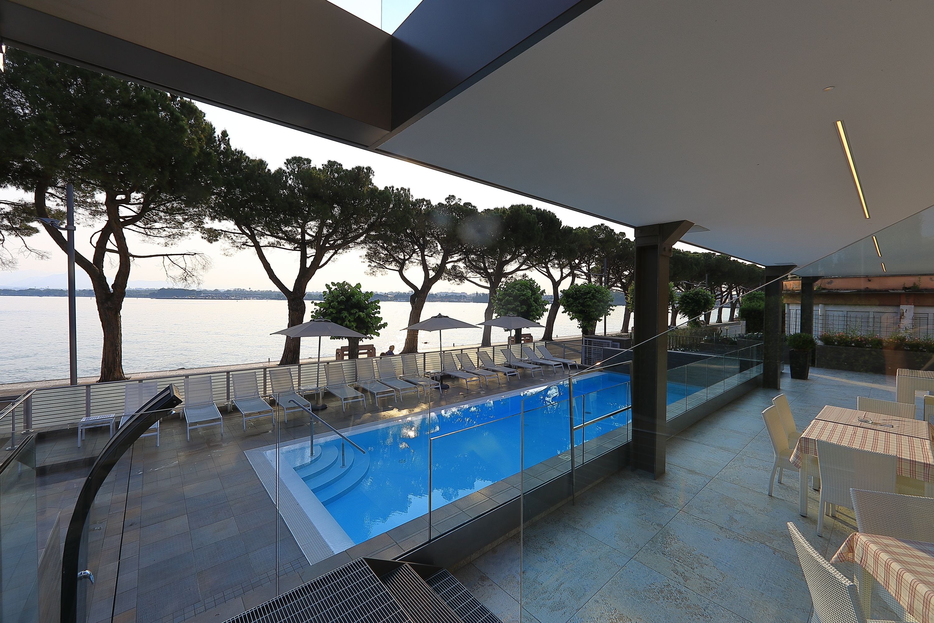 seasonal outdoor pool, pool umbrellas, pool loungers