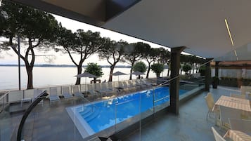 Seasonal outdoor pool, pool umbrellas, pool loungers