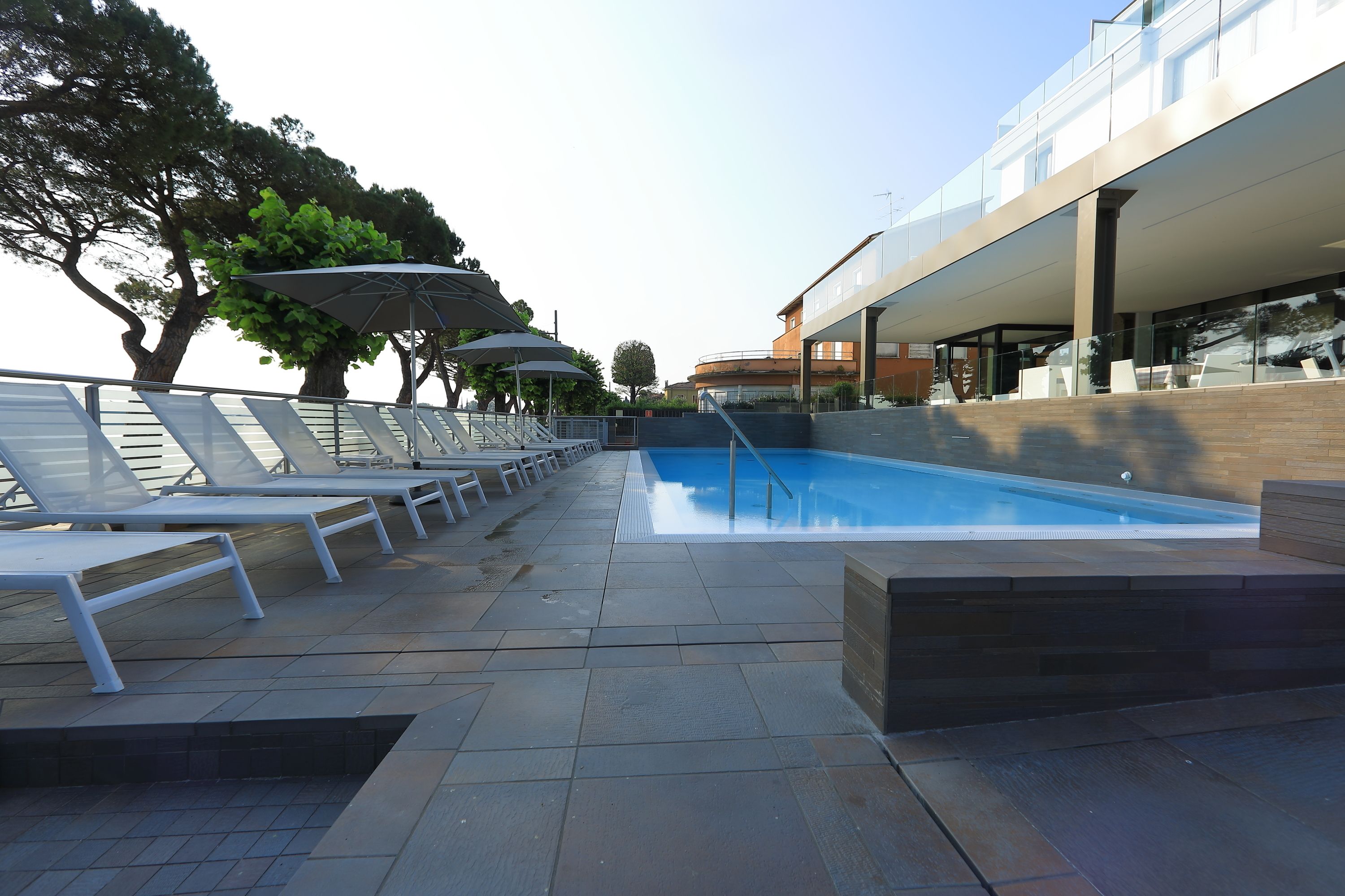 seasonal outdoor pool, pool umbrellas, pool loungers