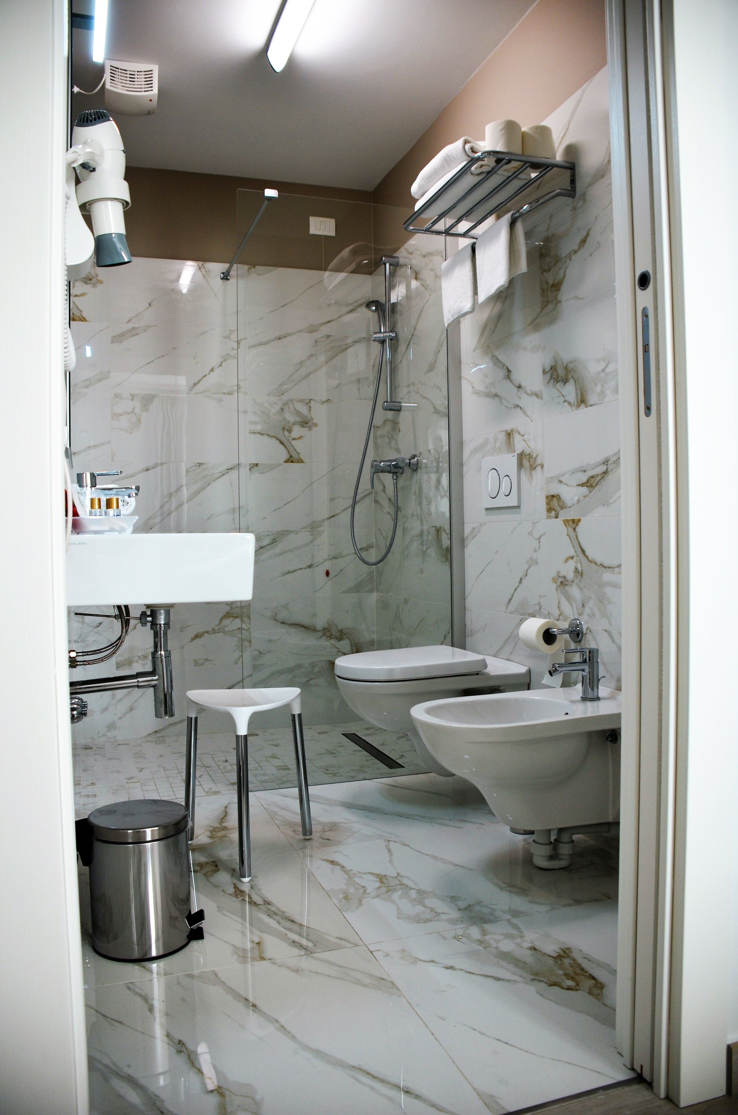 shower, hair dryer, slippers, bidet