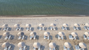 On the beach, beach towels, windsurfing, beach volleyball