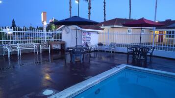 Seasonal outdoor pool, pool loungers