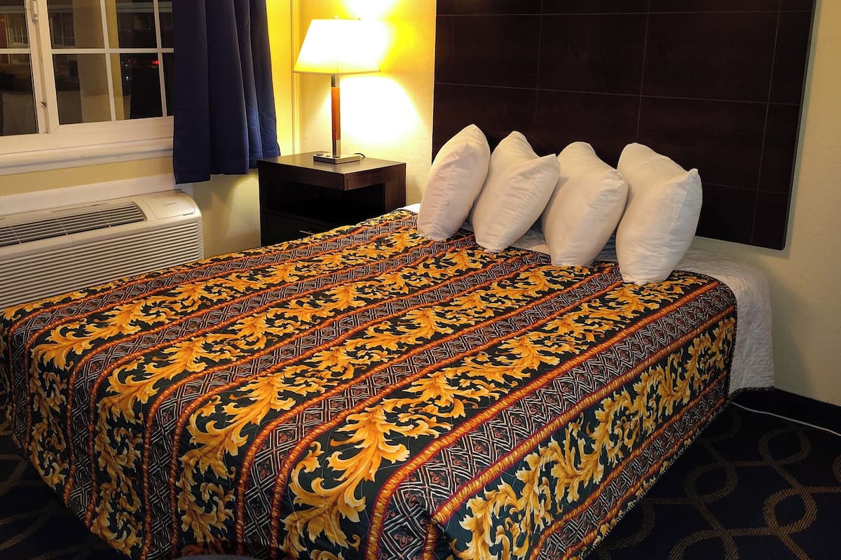 One queen bed non smoking | Desk, laptop workspace, blackout drapes, iron/ironing board