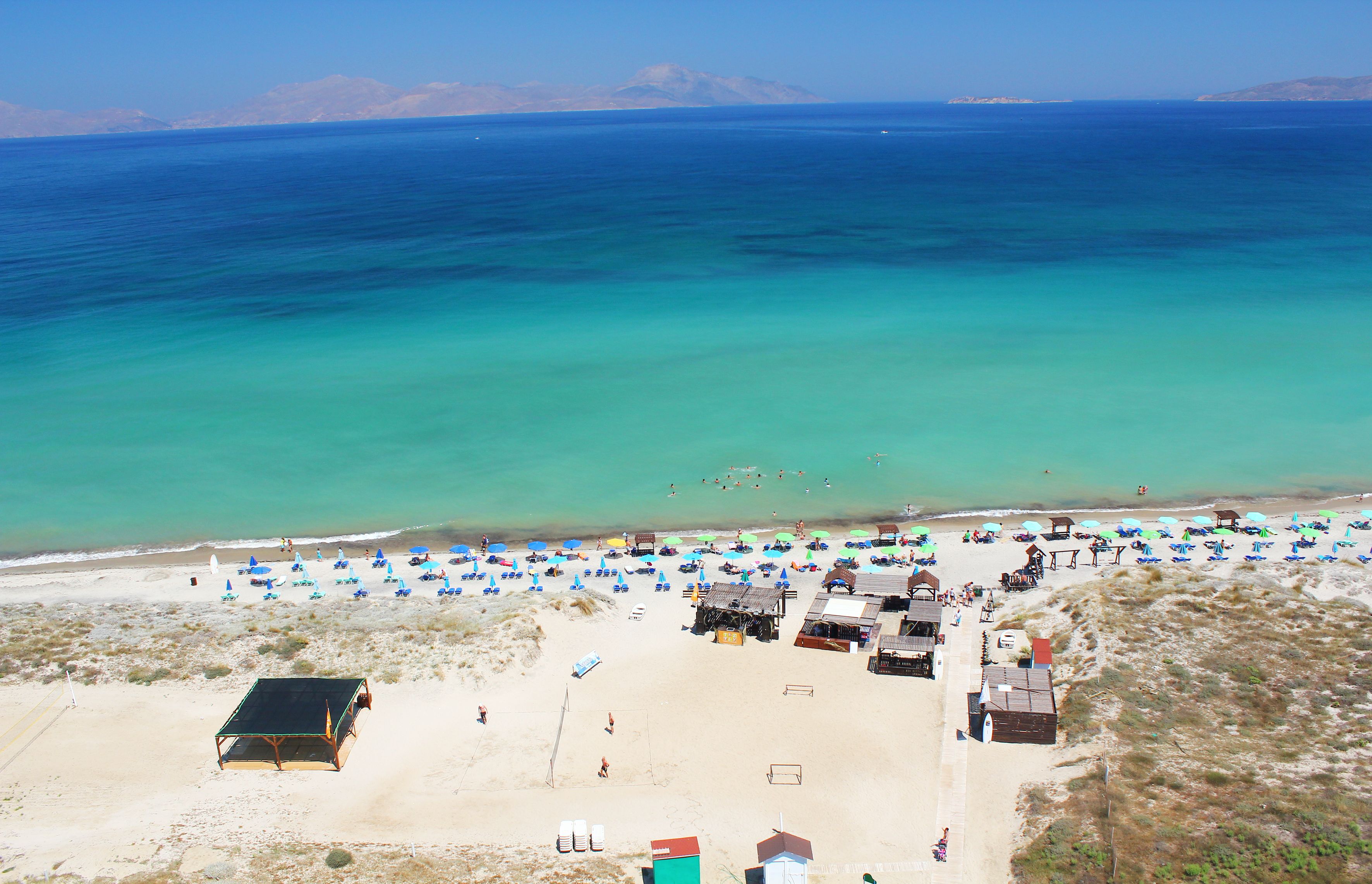 On the beach, sun-loungers, beach umbrellas, beach towels