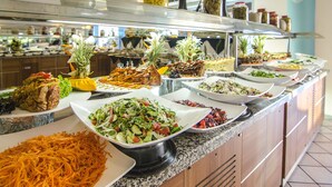 A buffet with various dishes including salads, vegetables, and meats. - The Grand Blue Sky International (Kusadasi)
