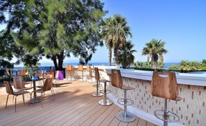 6 bars/lounges, poolside bar, beach bar