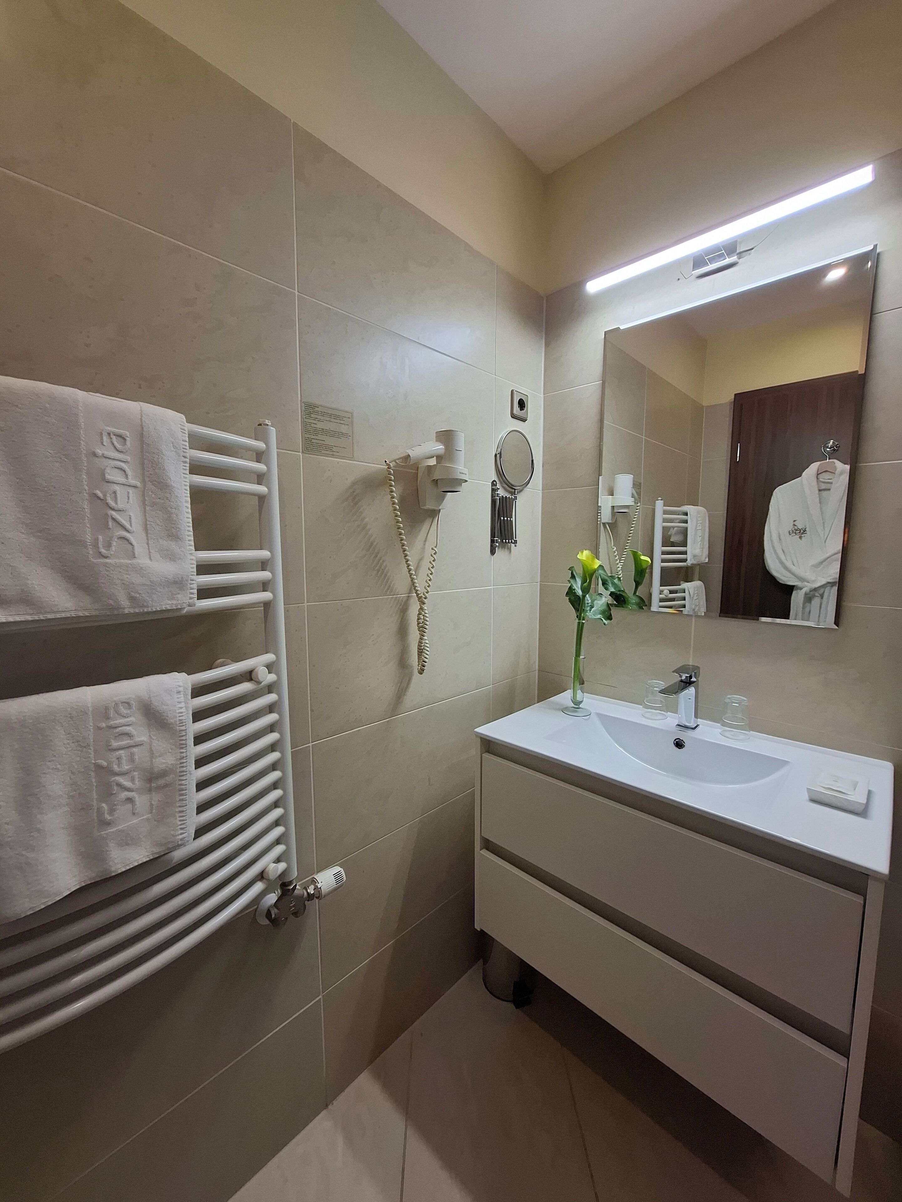 hair dryer, bathrobes, towels