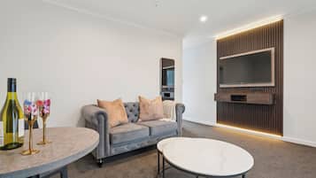 Luxury Room, 1 Bedroom | Living area | TV