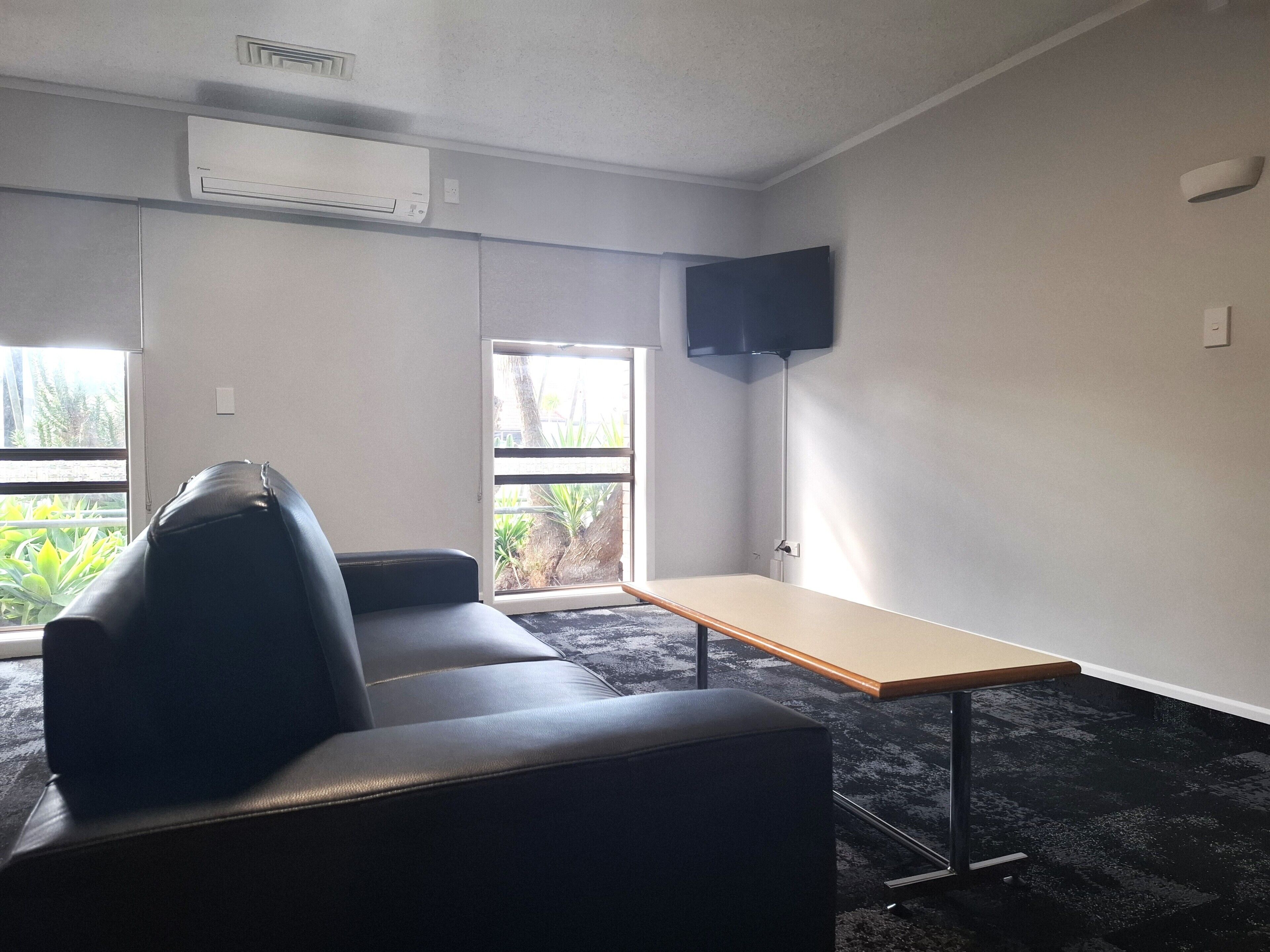 Townhome | Living area | 42-inch flat-screen TV with satellite channels, TV