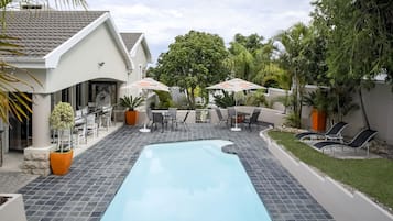 Outdoor pool, pool umbrellas, pool loungers