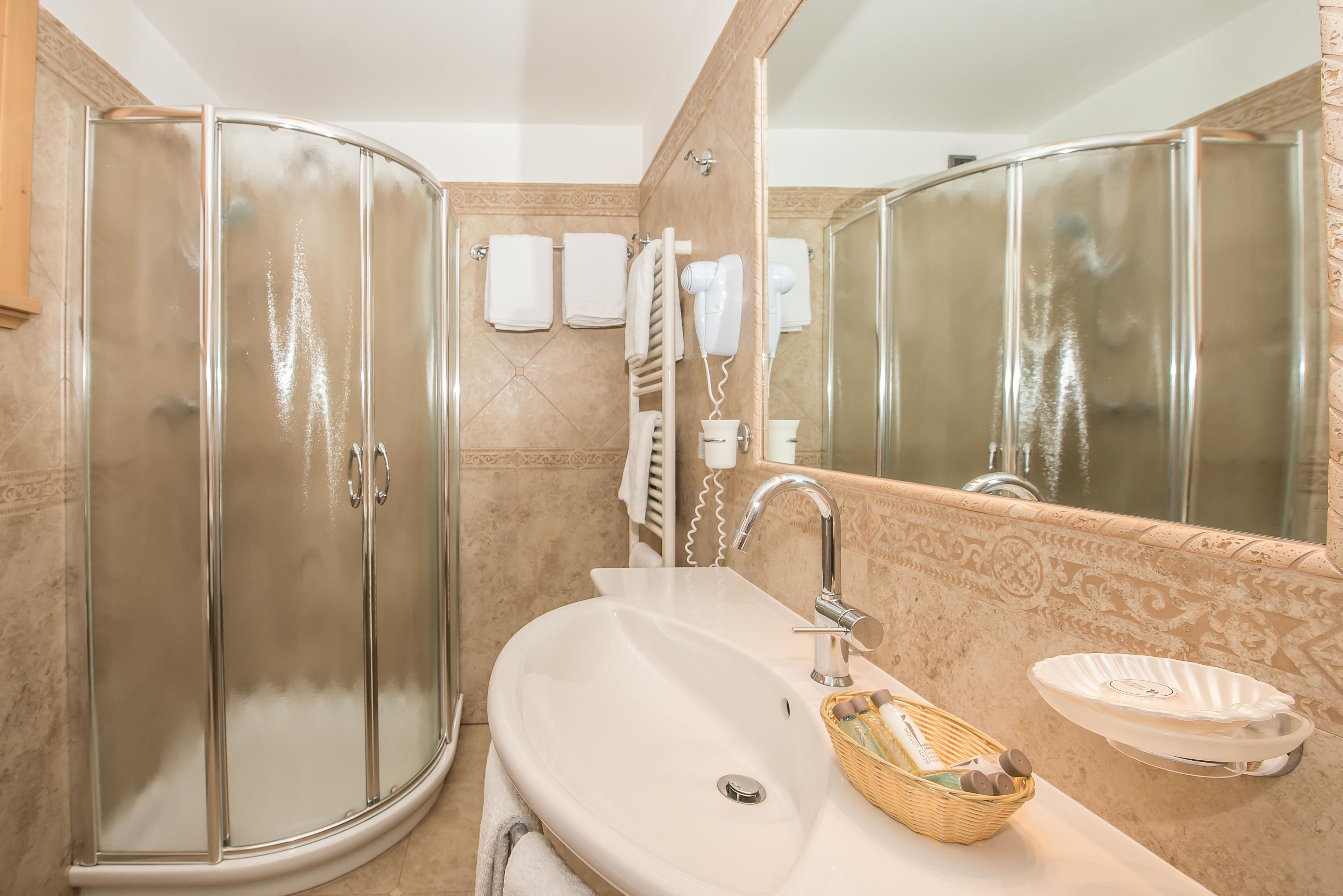 junior suite | bathroom | shower, rainfall showerhead, designer toiletries, hair dryer