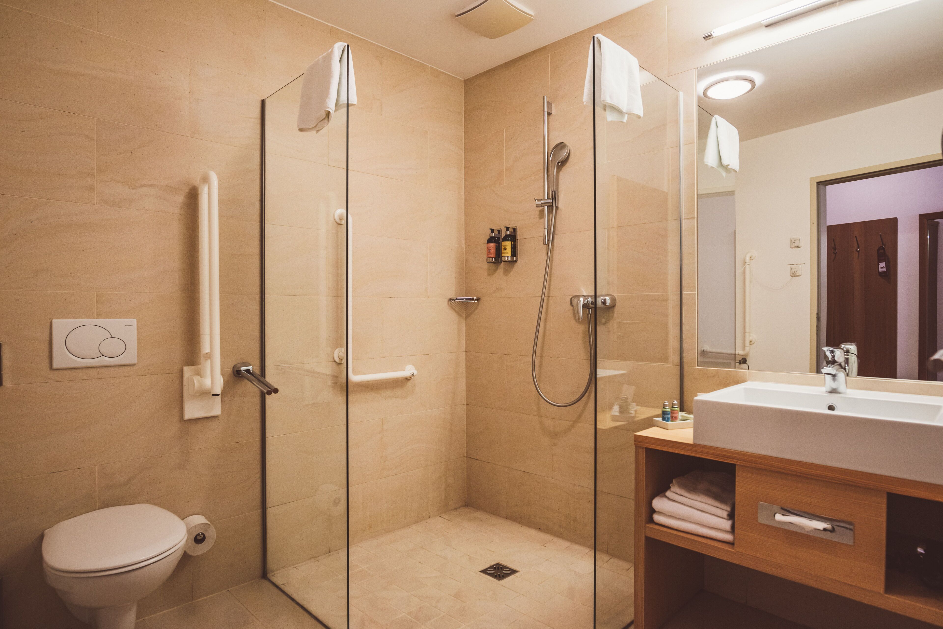 superior double room (lake view, german twin beds) | bathroom | hair dryer, slippers, towels, soap