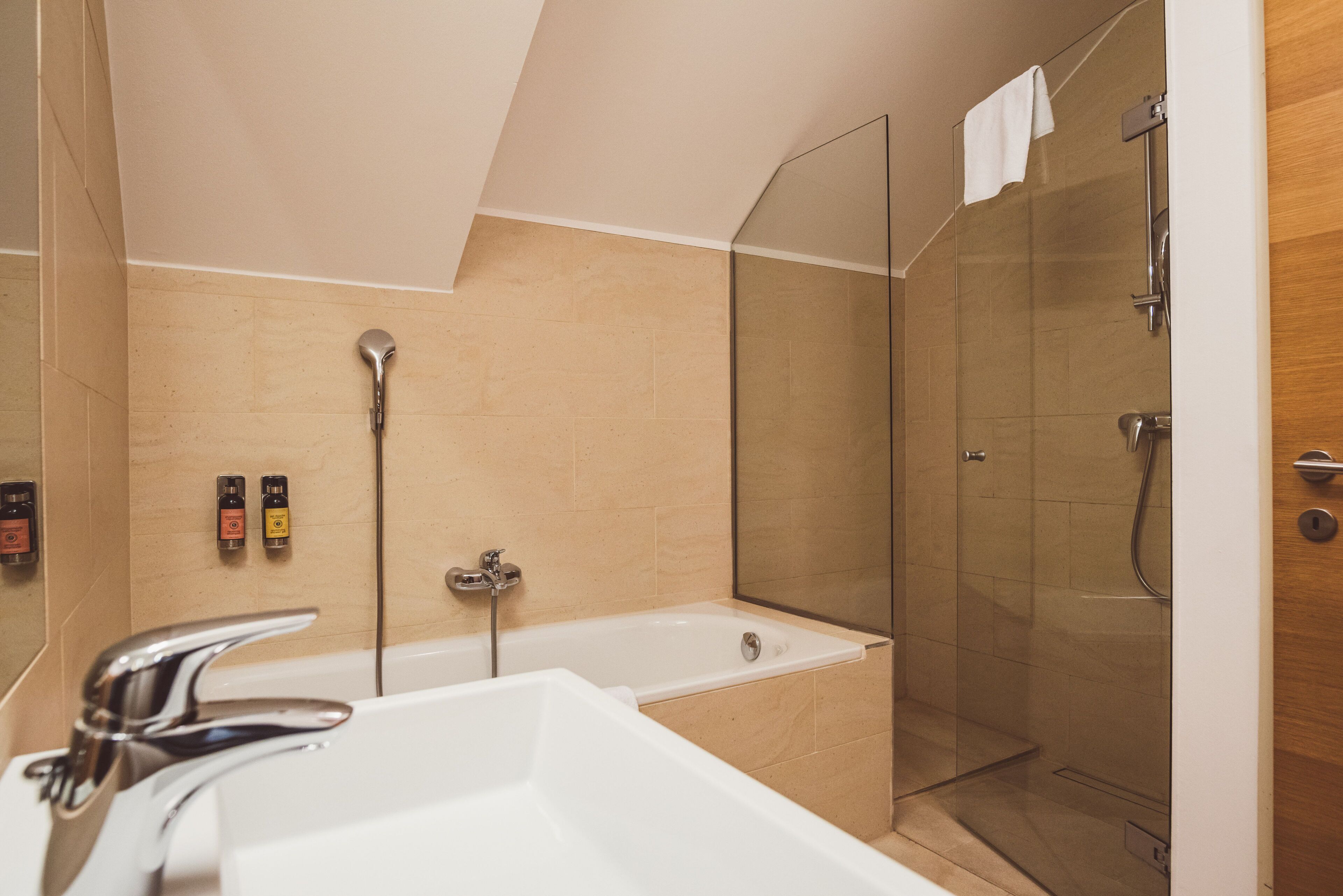 junior double or twin room (german twin beds) | bathroom | hair dryer, slippers, towels, soap