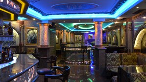 A bar area with marble countertops, cushioned seating, and decorative columns. - Boris Palace Boutique Hotel & Winery (Plovdiv)