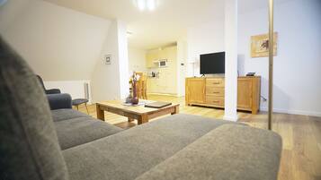 Dreibettzimmer | Wohnbereich | Fernseher