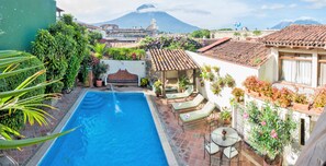 Outdoor pool, open 9:00 AM to 10:00 PM, sun loungers