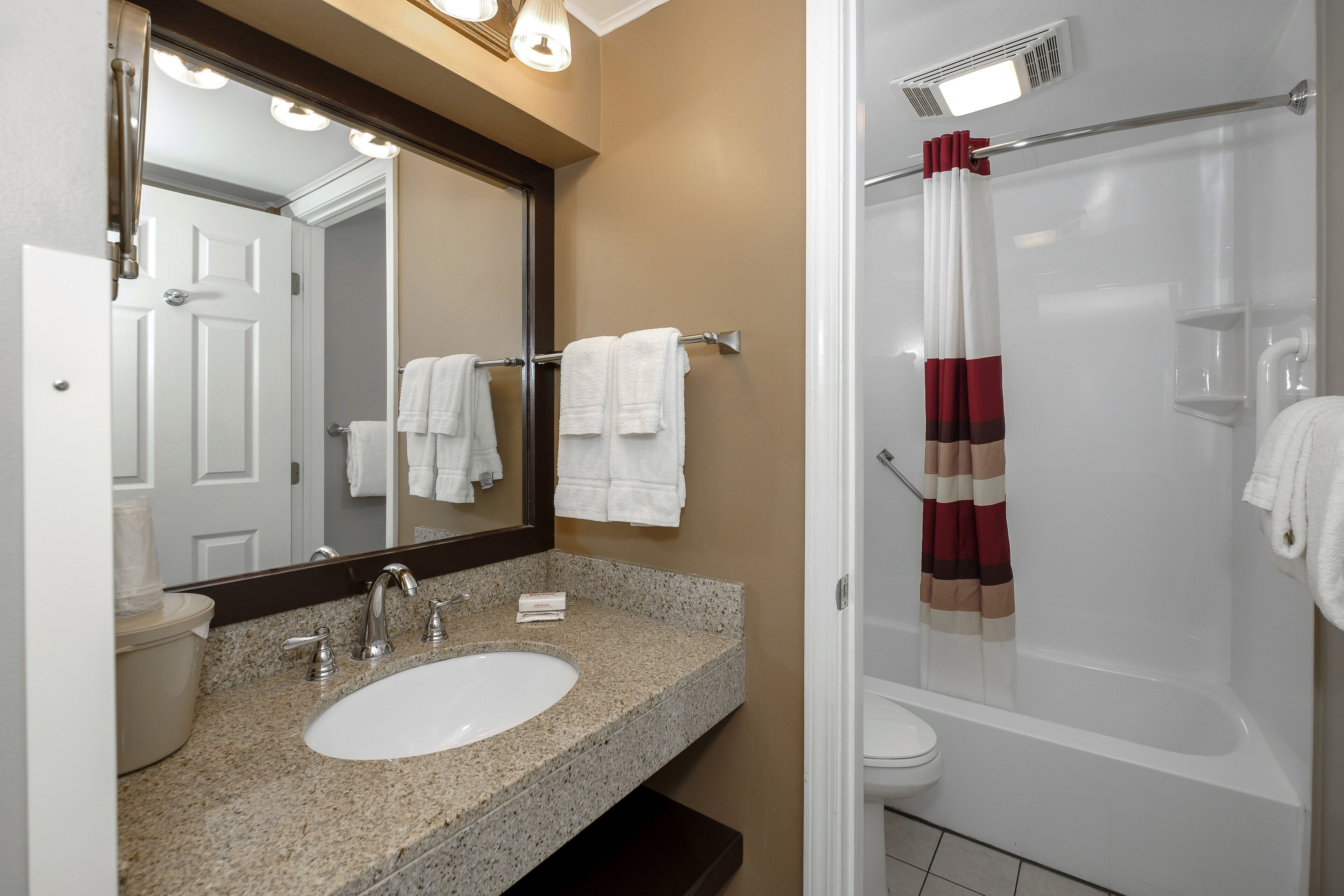 suite, 2 queen beds (smoke free) | bathroom | combined shower/bathtub, free toiletries, hair dryer, towels