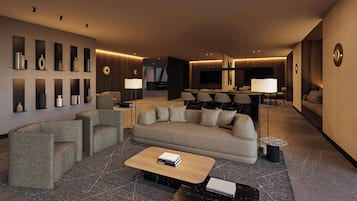 Un moderno vestíbulo de hotel con un sofá, sillones, una mesa baja y un área de comedor con sillas y una mesa.