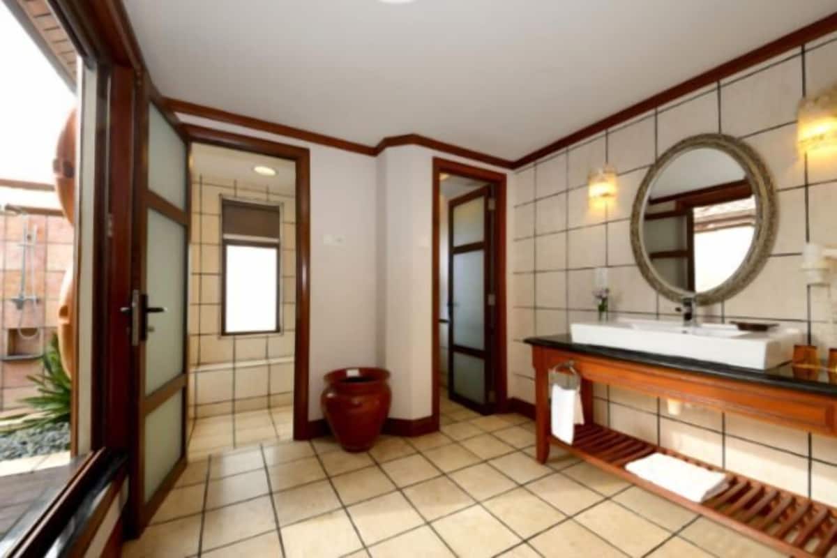 Bathroom | Shower, rainfall showerhead, hair dryer, bathrobes