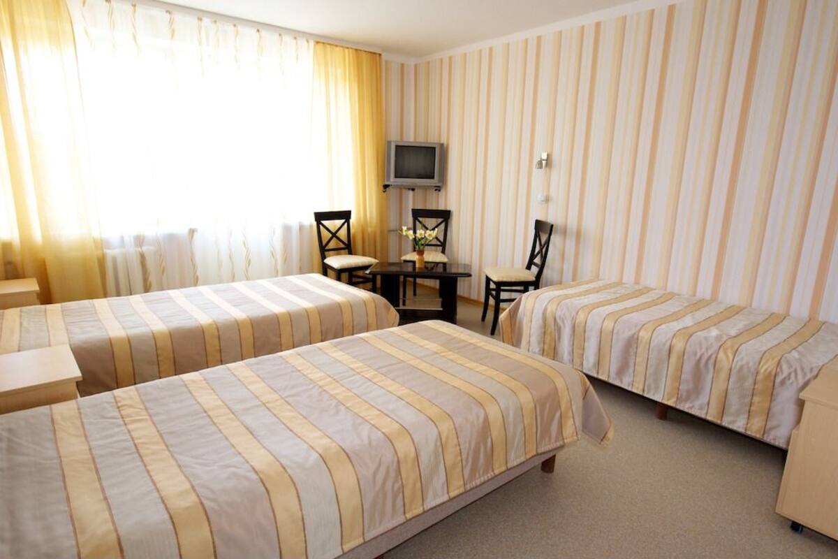 Triple Room | Iron/ironing board (on request), cribs (surcharge), bed sheets