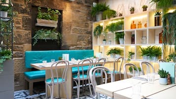 Breakfast, lunch, dinner served; local cuisine, al fresco dining