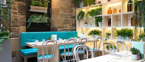Breakfast, lunch, dinner served; local cuisine, al fresco dining