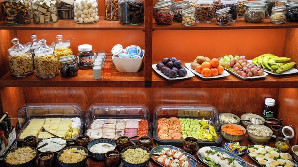 A buffet with various food items and condiments. - Villa Admiral (Gdynia)