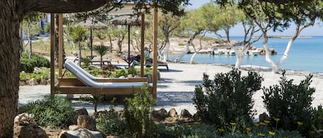 On the beach, sun-loungers, beach umbrellas, beach towels