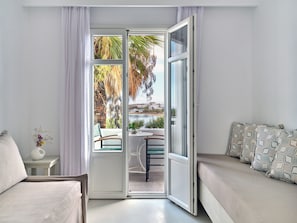 Suite, 2 Bedrooms | Living area | 28-inch TV with satellite channels - Kalypso Hotel (Paros)