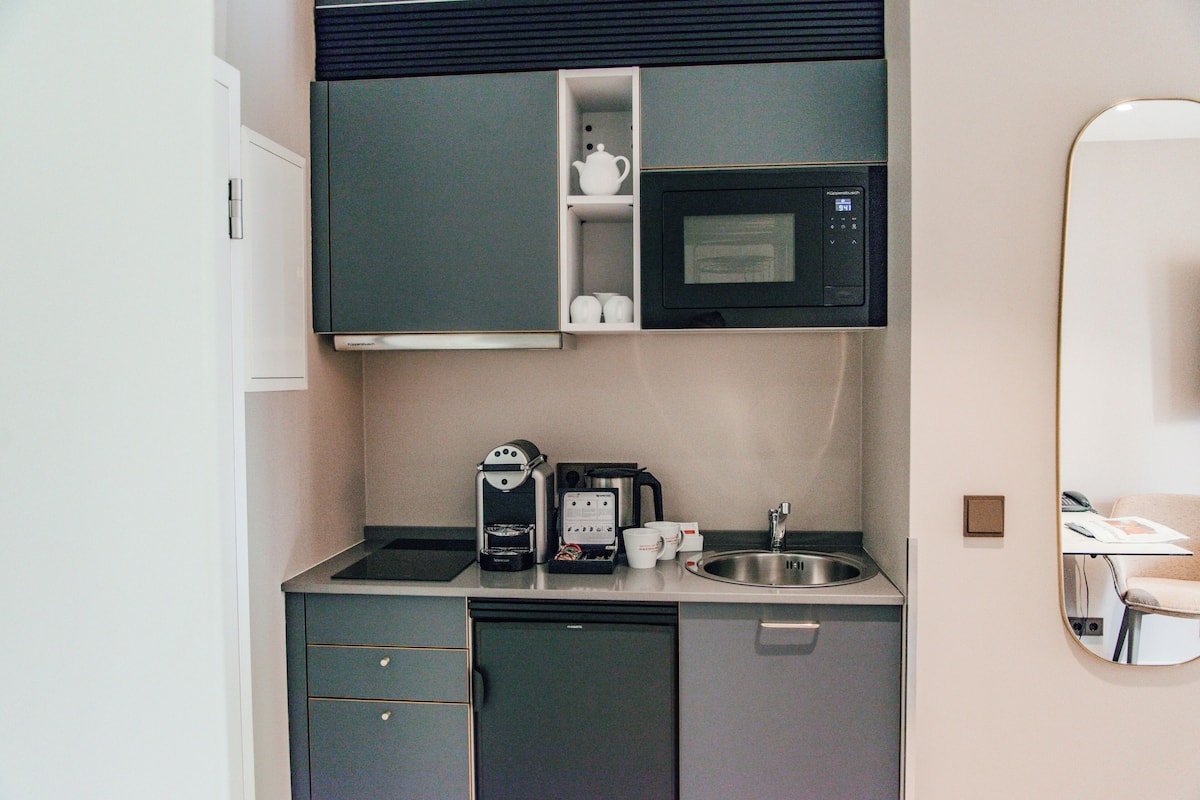 deluxe studio, 1 king bed, non smoking, garden view | private kitchen | full-sized fridge, microwave, stovetop, espresso maker